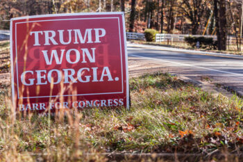 LAWRENCEVILLE, GA -  NOVEMBER 20 :  A campaign sign reading "Trump Won Georgia" sits in the grass beside a street on November 20, 2021 in Lawrenceville, GA.